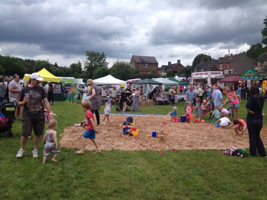 An inland beach under a lowering sky.